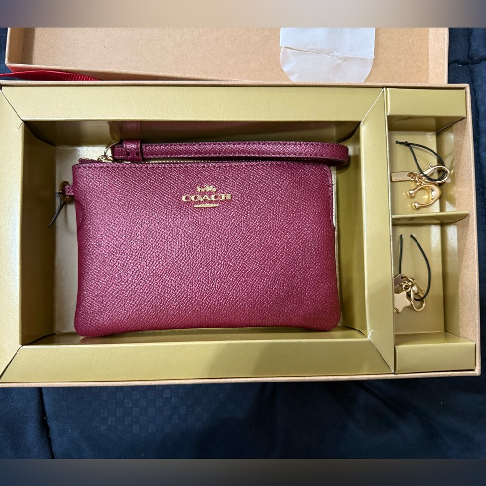 NEVER USED, Coach purple sparkle wrist wallet with charms, gift box included